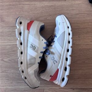 On Running Beige and Red Athletic Shoes